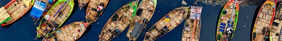 aerial-view-of-fishing-boats-docked-along-the-river-3011582