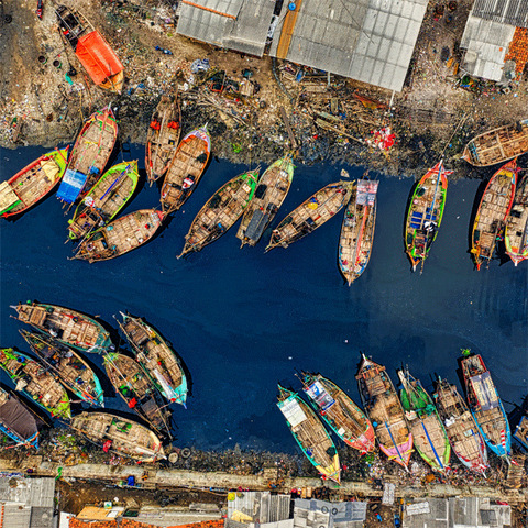 aerial-view-of-fishing-boats-docked-along-the-river-3011582